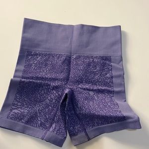 Purple Lululemon biker shorts